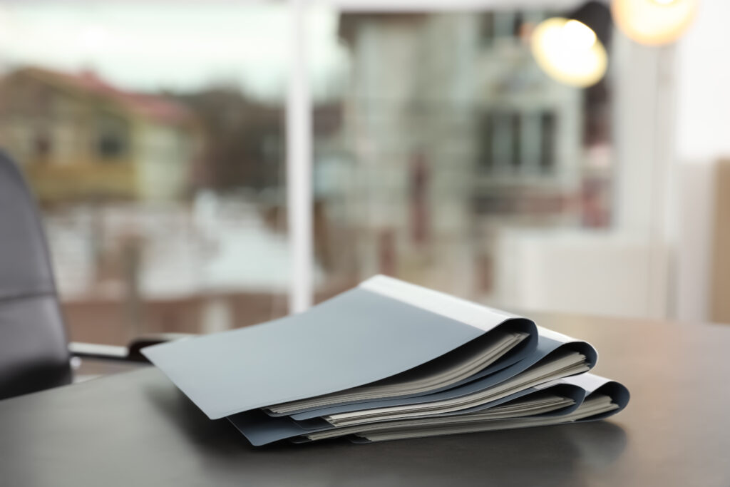 Stack Of Folders With Documents On Office Table Space For Text