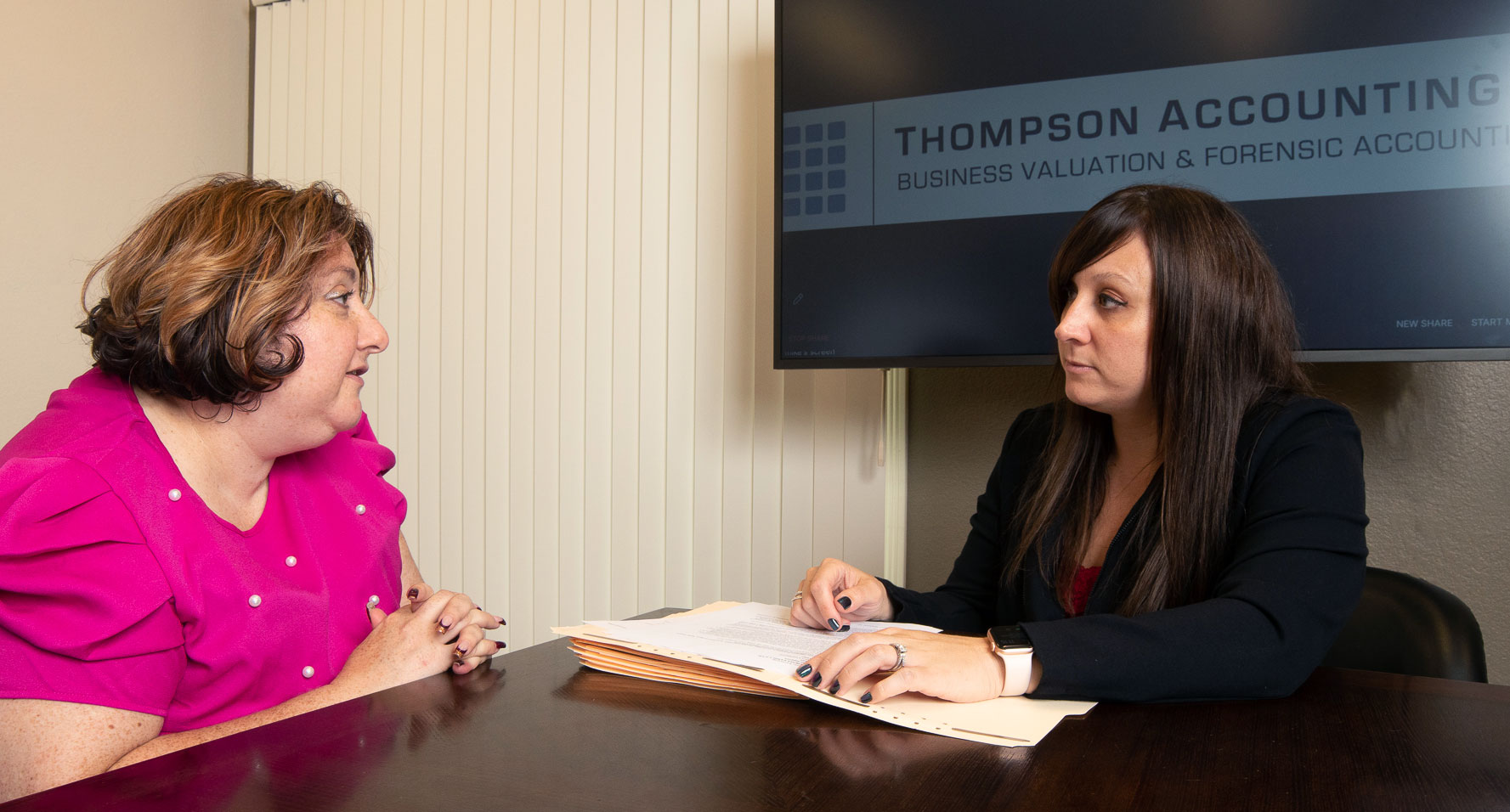 Megan Thompson consulting with a client in her office
